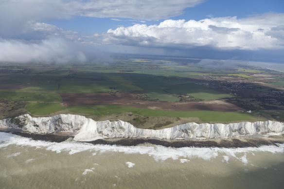 View of green fields from the top of a mountain