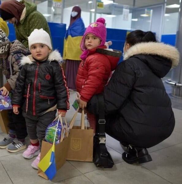 Ukrainian women and children refugees at a checkpoint