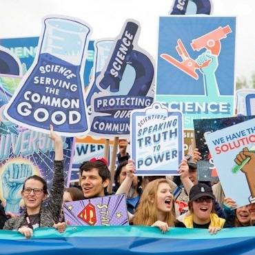 Protesters at the 'March for Science' hold banners with slogans such as 'Science serving the common good' in Washington DC, 2017