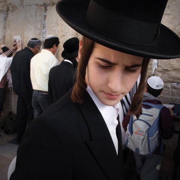 Jewish men pray at the Western Wall in Jerusalem