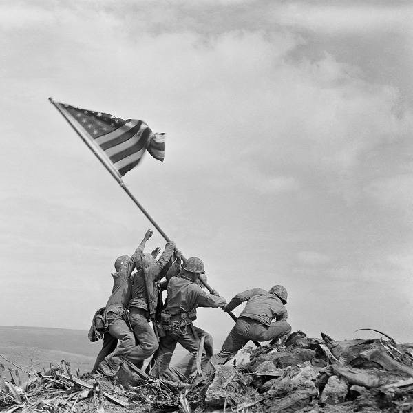 Six US marines raise the American flag on Iwo Jima after capturing the island from the Imperial Japanese Army during the Second World War