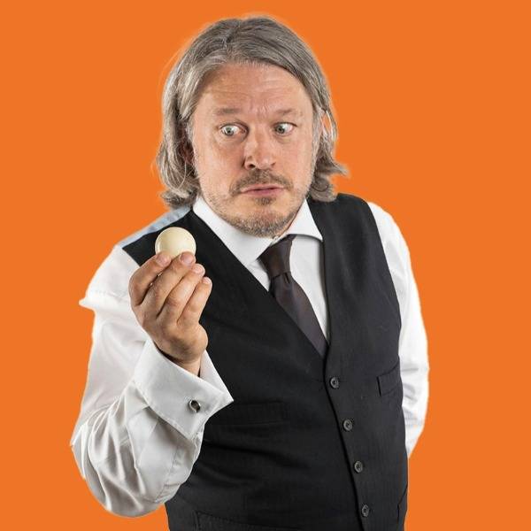 Richard Herring holds a snooker ball