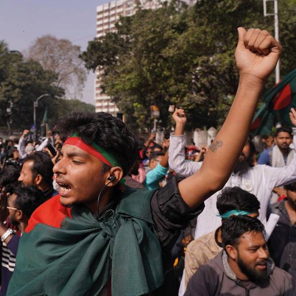 A protester raises his fist in the air