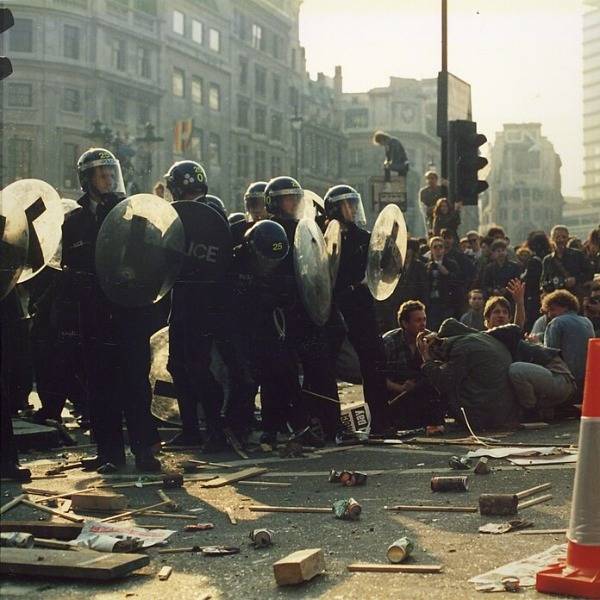 Riot police face down protesters during the poll tax riot of 1990