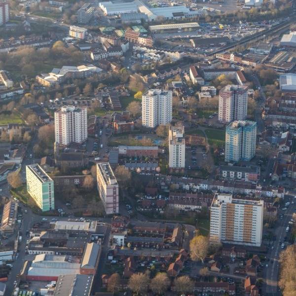 An aerial view of several tower blocks and buildings making up the Barton Hill flats and estate in Bristol