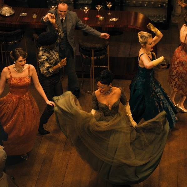 Guests dance in a scene from Hedda