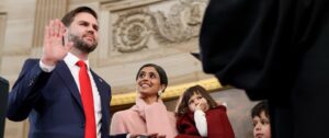 JD Vance rests his hand on the Bible as he is sworn in as vice president