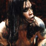 Ozzy Osbourne performs on stage