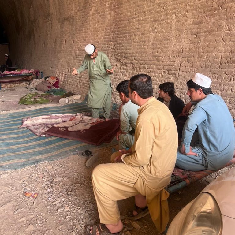 Civilians shelter in a railway tunnel during shelling