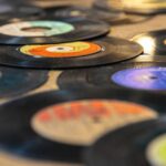 A pile of vinyls on a table