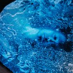 An artistic representation of a man in a cryonics chamber