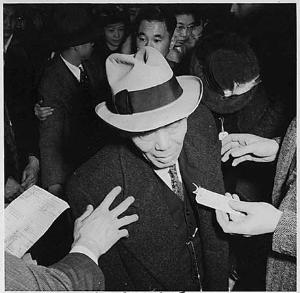 Dorothea Lange, stepping on to the bus for the assembly centre, April 6, 1942, San Francisco
