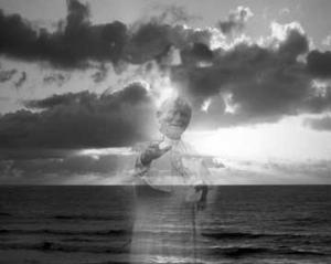 A ghostly Pope John Paul II floating out at sea