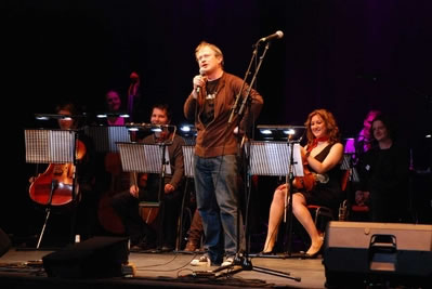 Robin Ince on stage with the Mystery Fax Machine Orchestra in the Nine Lessons and Carols for Godless People show, London, 19 December 2008 (Photo: Chris Brown/Go Faster Stripe)