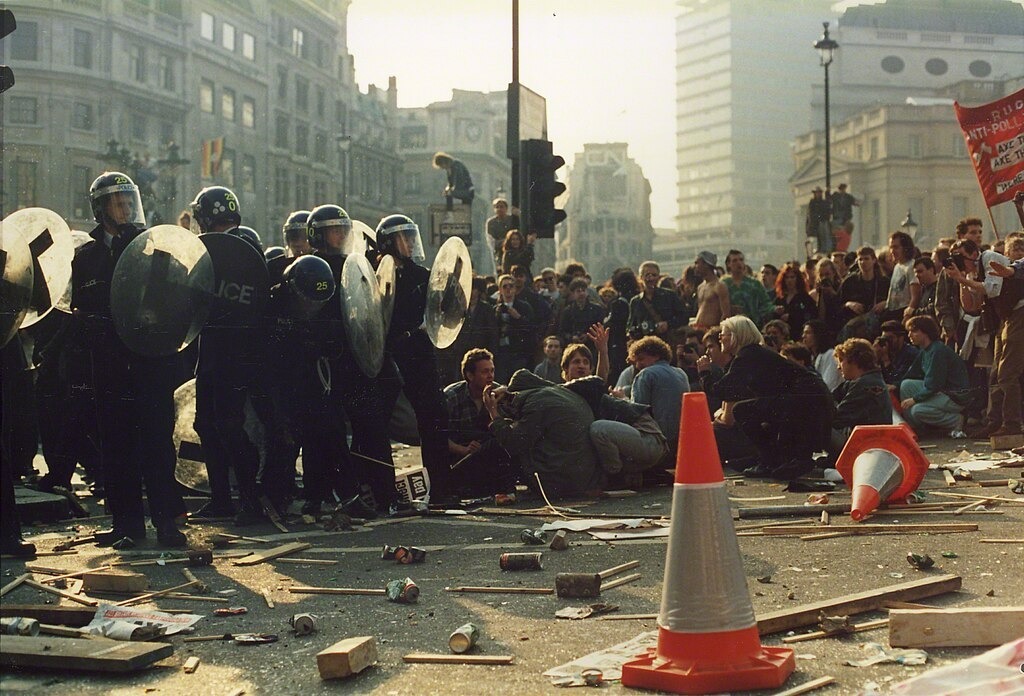 Riot police face down protesters during the poll tax riot of 1990