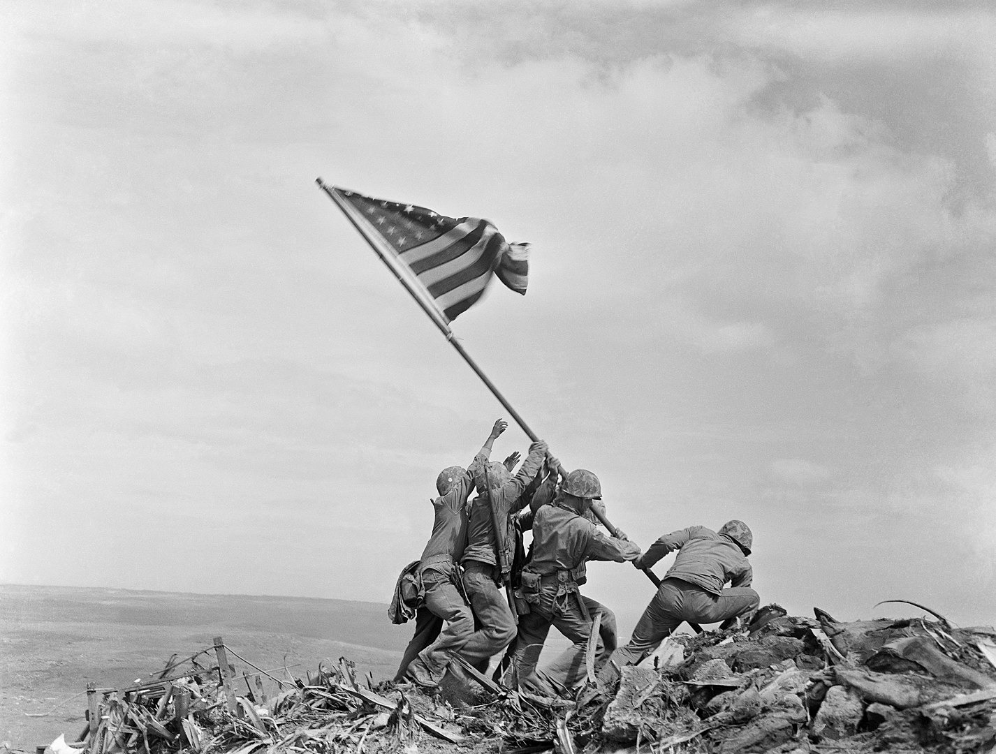 Six US marines raise the American flag on Iwo Jima after capturing the island from the Imperial Japanese Army during the Second World War