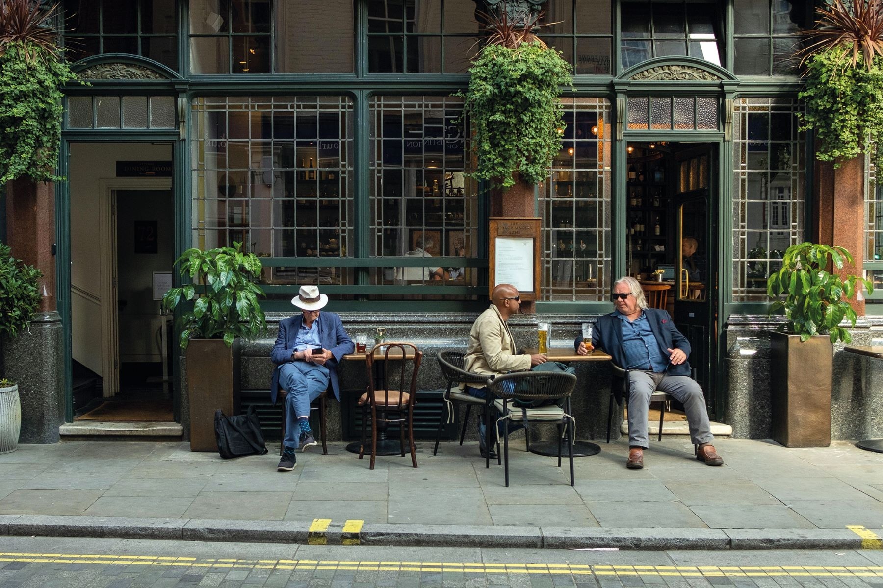 Patrons outside a pub in the Yorkshire Dales