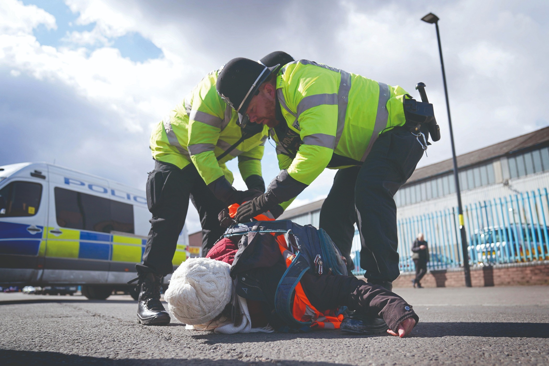 A Just Stop Oil protester is arrested outside Esso Birmingham Terminal