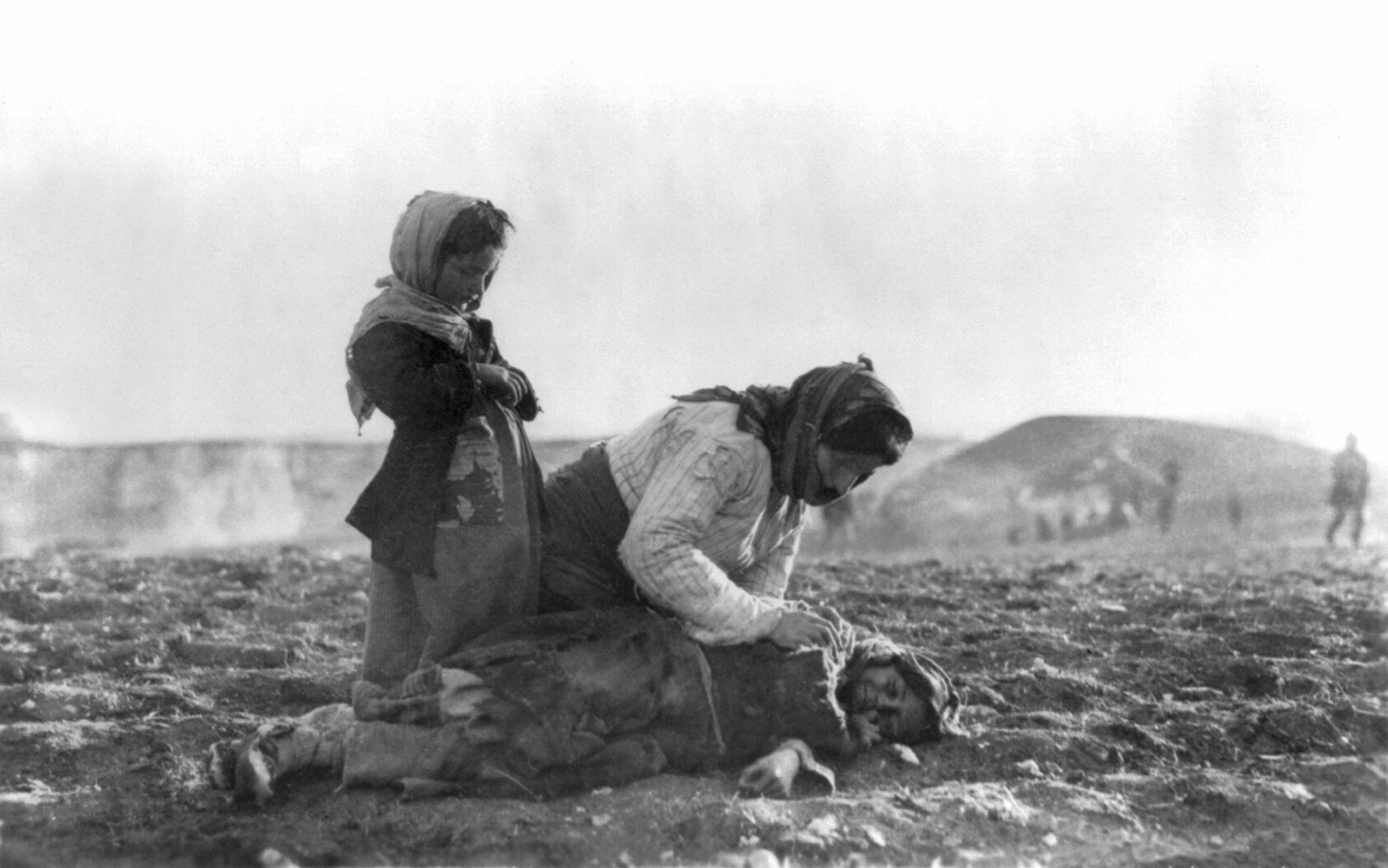 A woman crying over the body of a child during the Armenian genocide of 1915