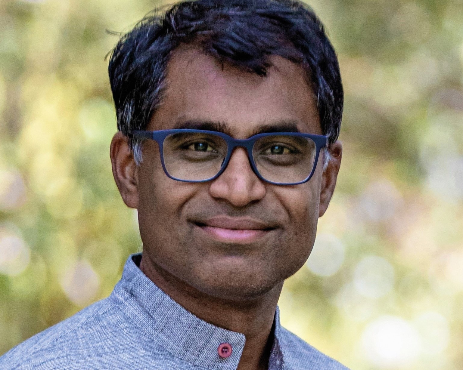 A close-up portrait photo of Danny Sriskandarajah