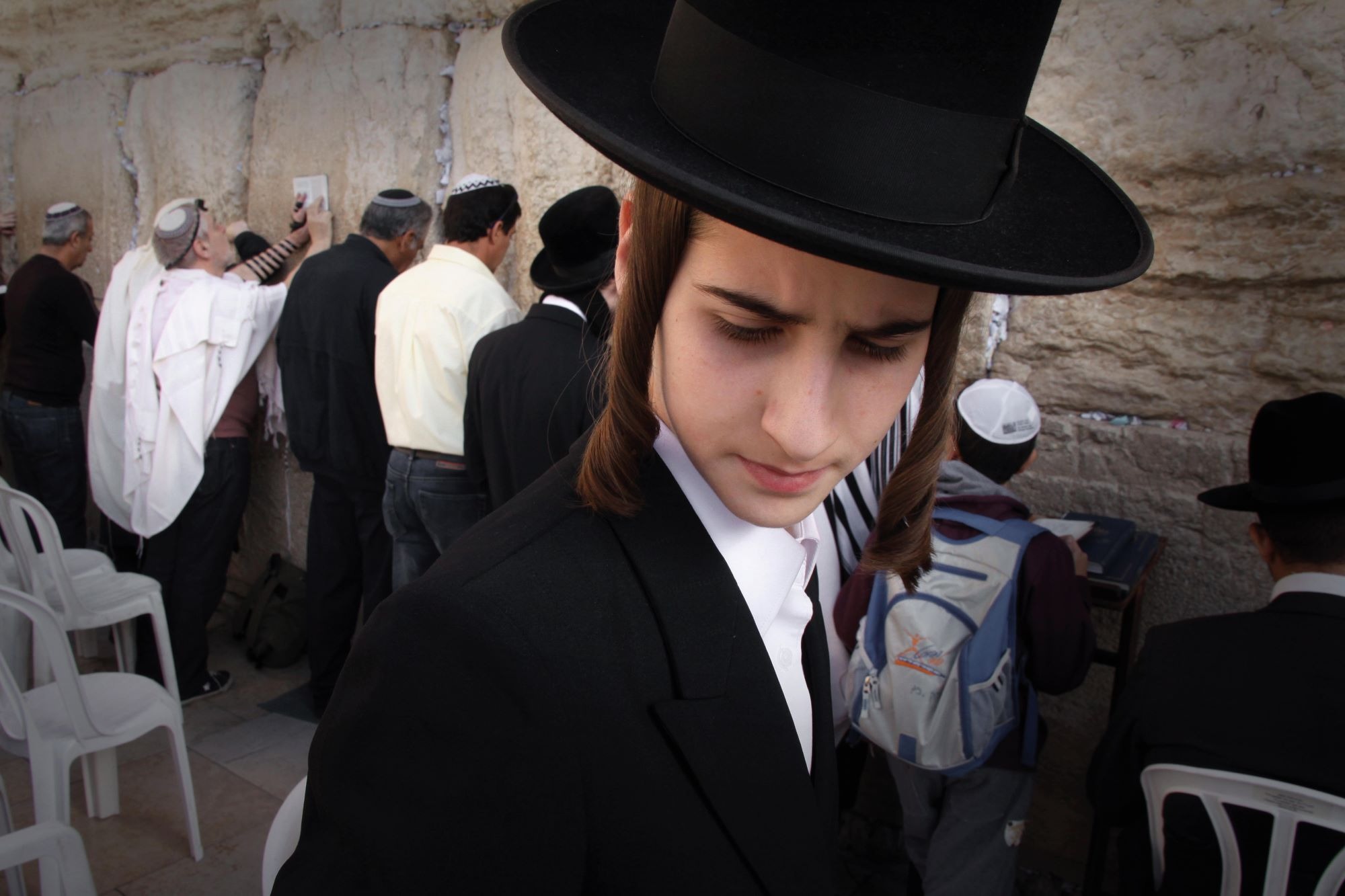 Jewish men pray at the Western Wall in Jerusalem