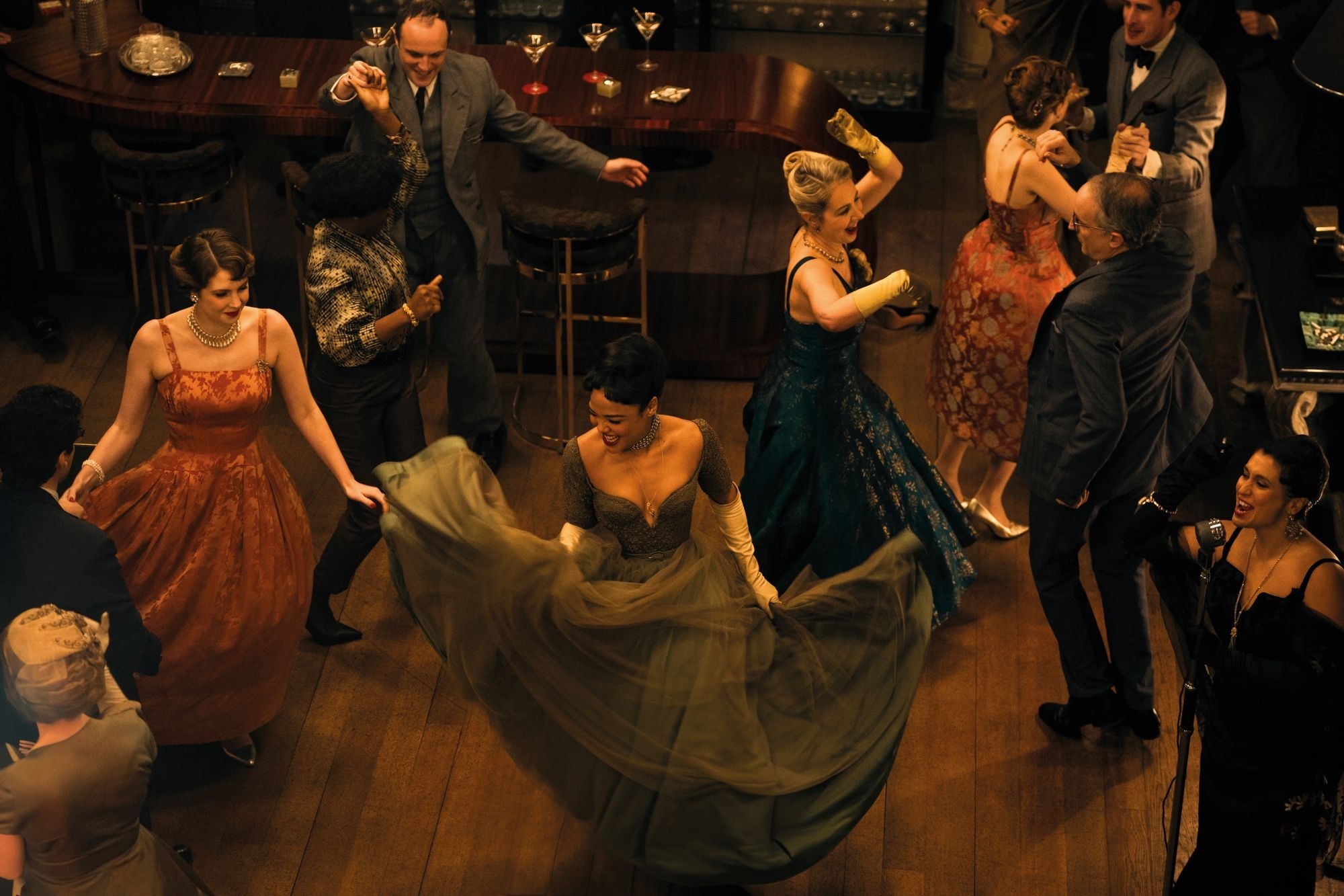 Guests dance in a scene from Hedda