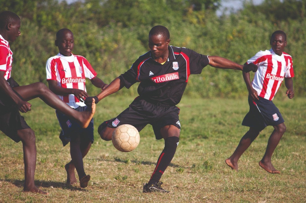 Students play football at a humanist school in Uganda