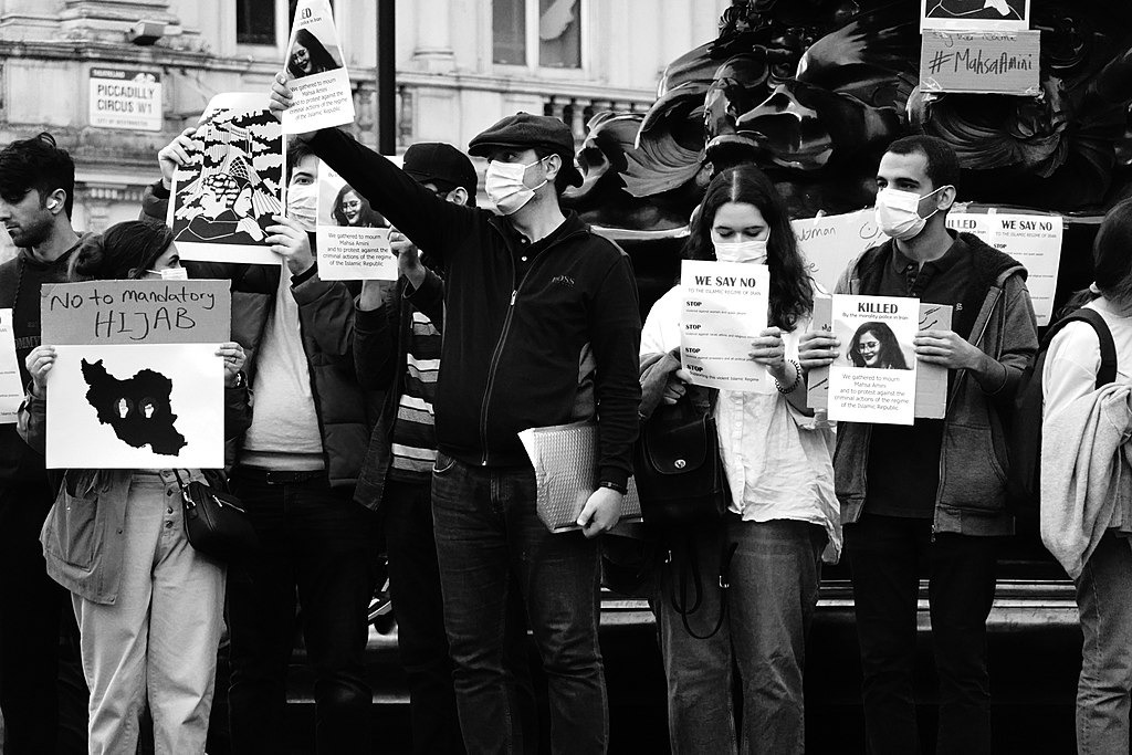 Photos taken at a protest at London's Piccadilly Circus against mandatory hijab in Iran.