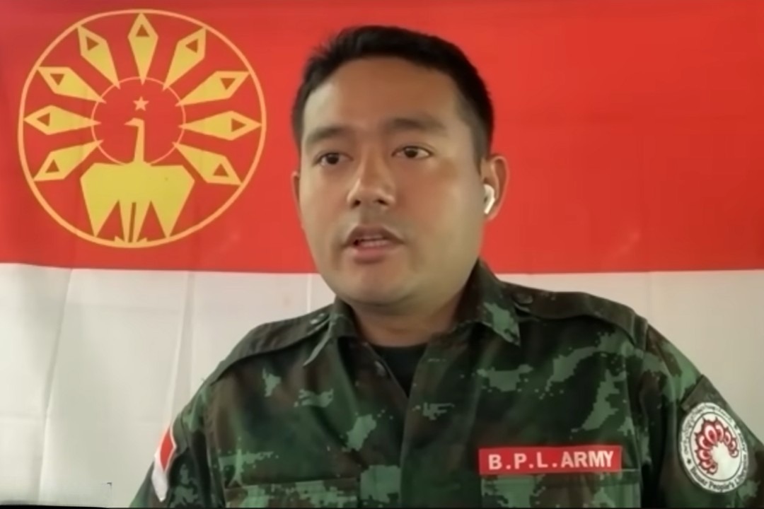 Poet Maung Saungkha dressed in military fatigues