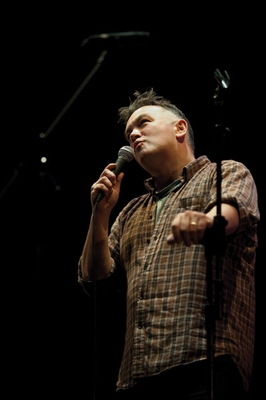 Stewart Leem, on stage at Nince Lesson and Carols For Godless People, December 2009