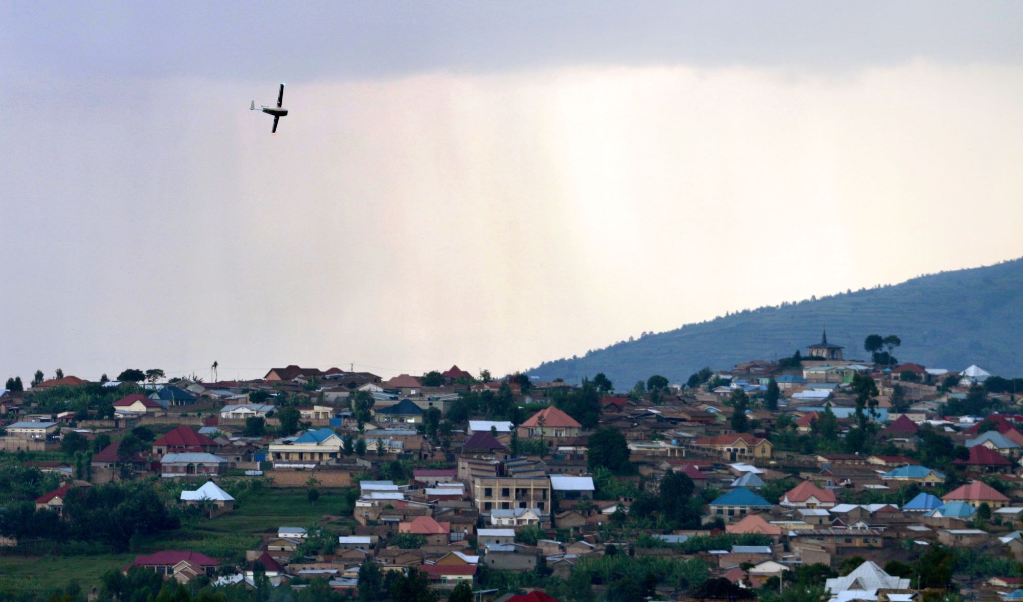 A Zipline drone flying over Muhanga, Rwanda