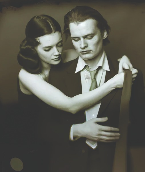 An AI-generated image from Boris Eldagsen's controversial ongoing series, 'Pseudomnesia', which shows a black and white, hyper-realistic image of a man and a woman with their arms around each other