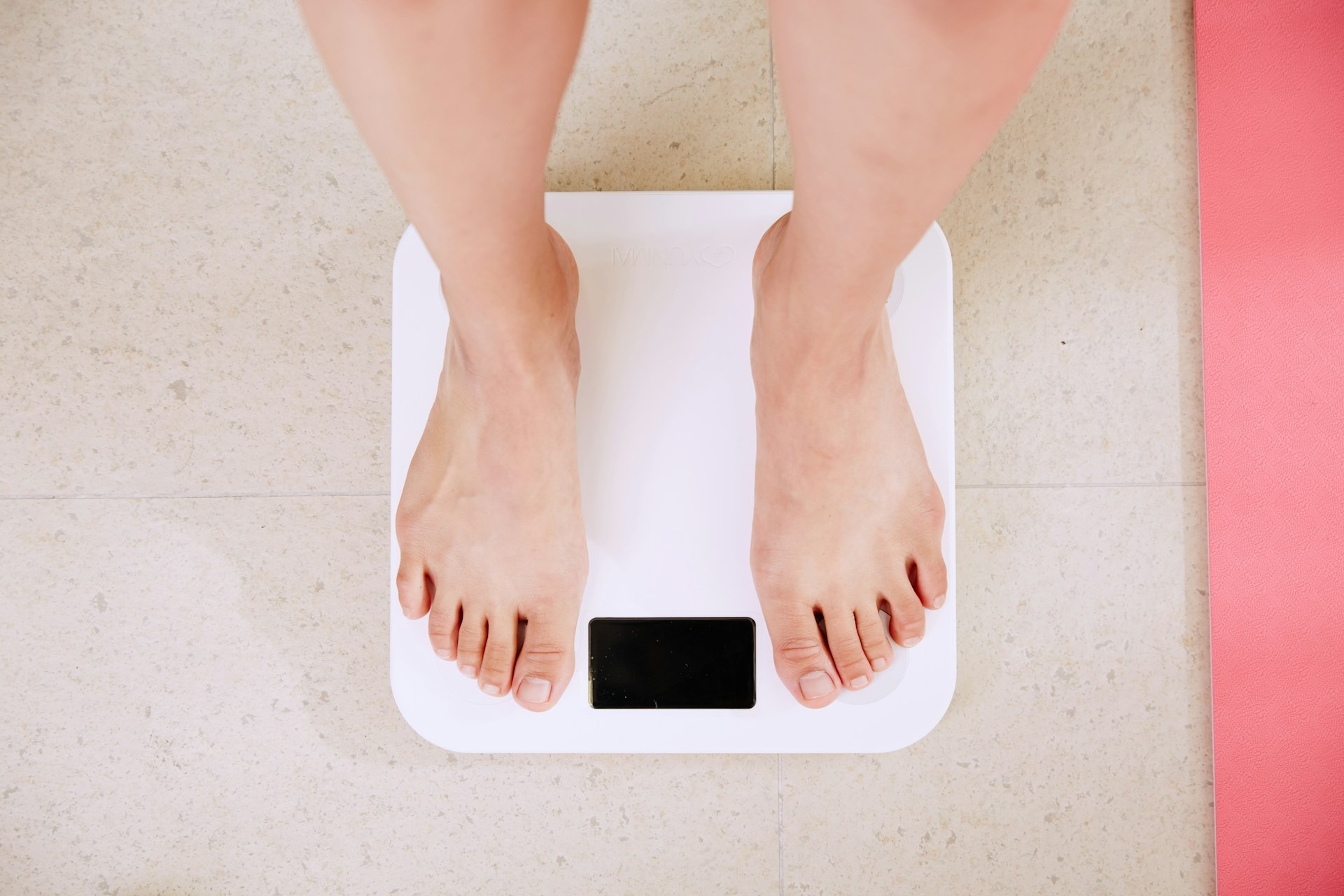 A person standing on weighing scales