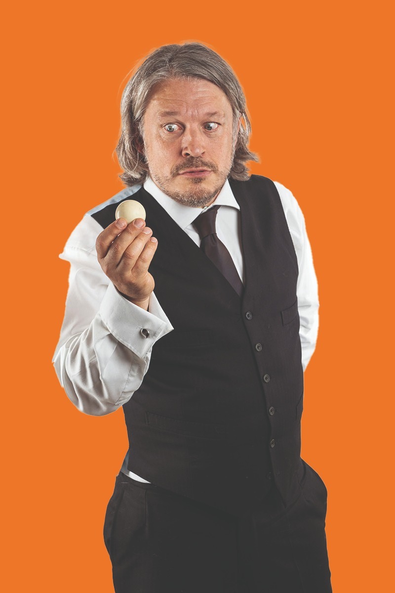 Richard Herring holds a snooker ball