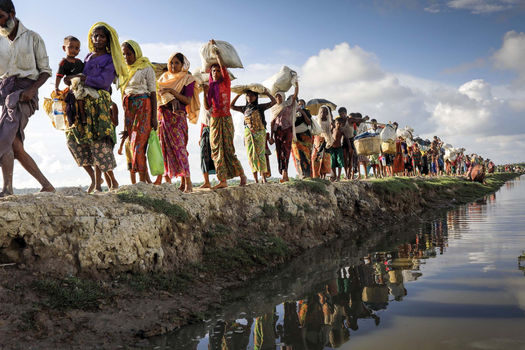 Rohingya people crossing the border into Bangladesh as they flee Myanmar